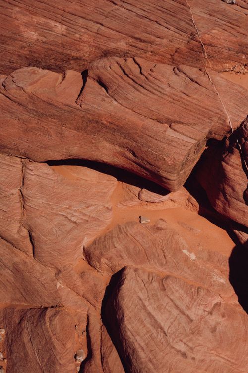 Free Eroded sandstone formations showcasing patterns in an arid desert environment. Stock Photo