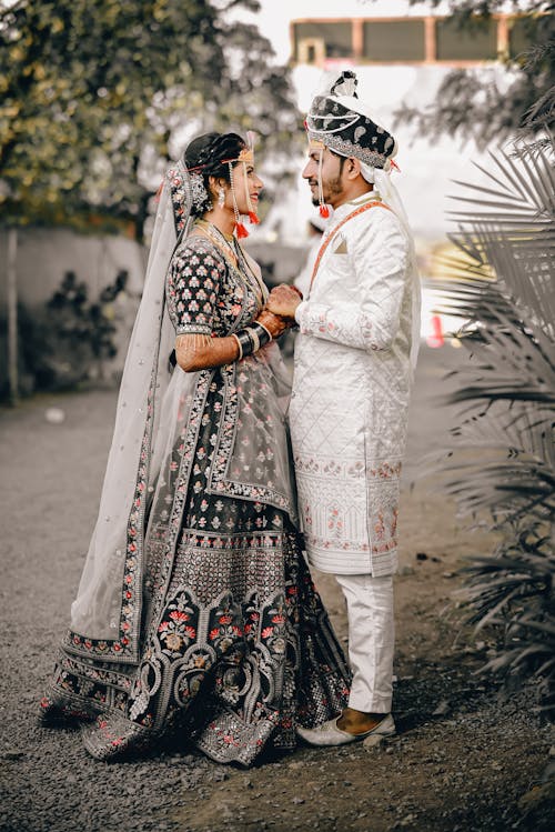 A bride and groom in traditional indian attire