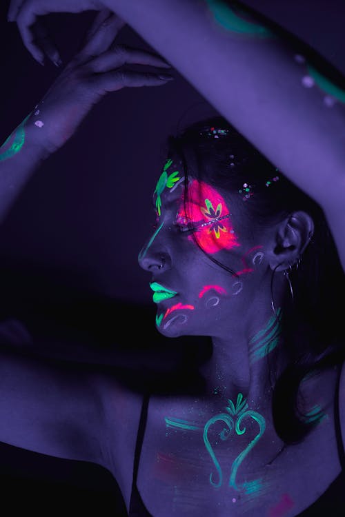 A woman with her face painted in black and white