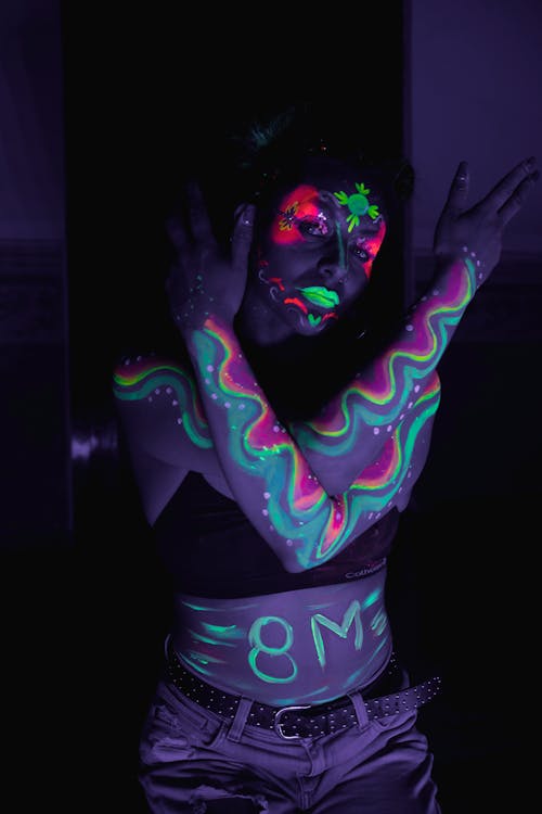 A woman with her face painted in black and white