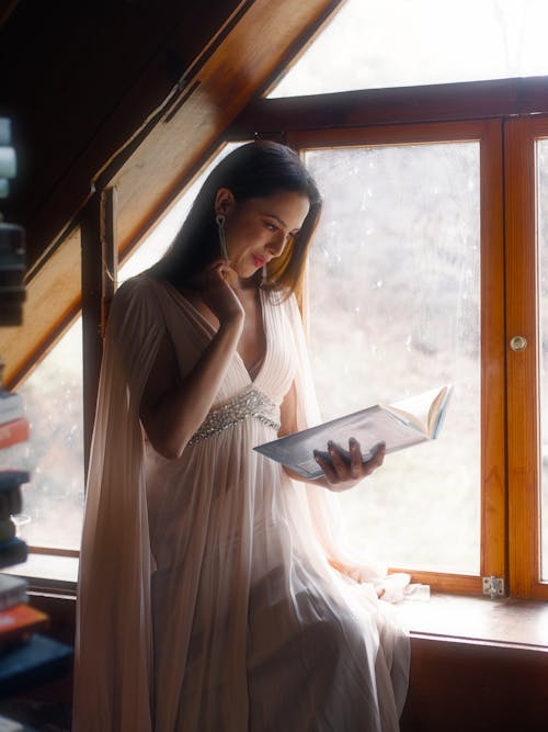 Smiling Woman in Dress and with Book