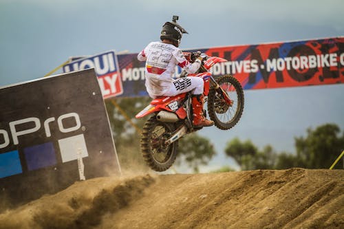 A person riding a dirt bike on a track