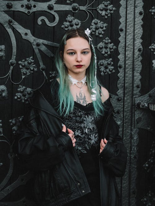 A girl with green hair and black jacket