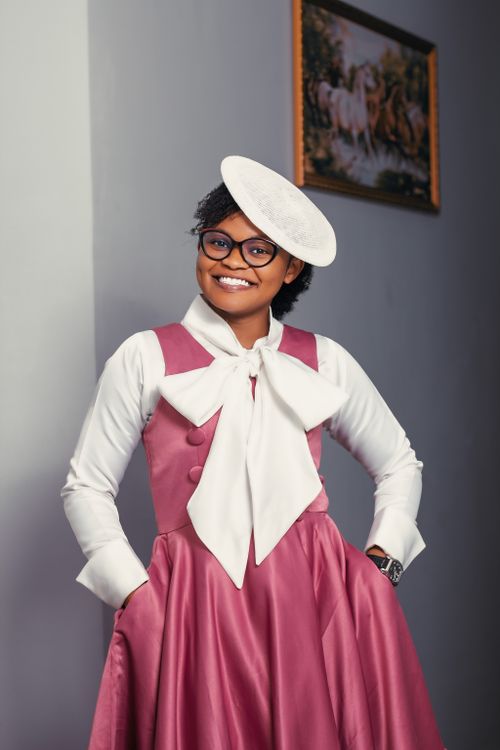 A woman in a pink dress and white hat · Free Stock Photo
