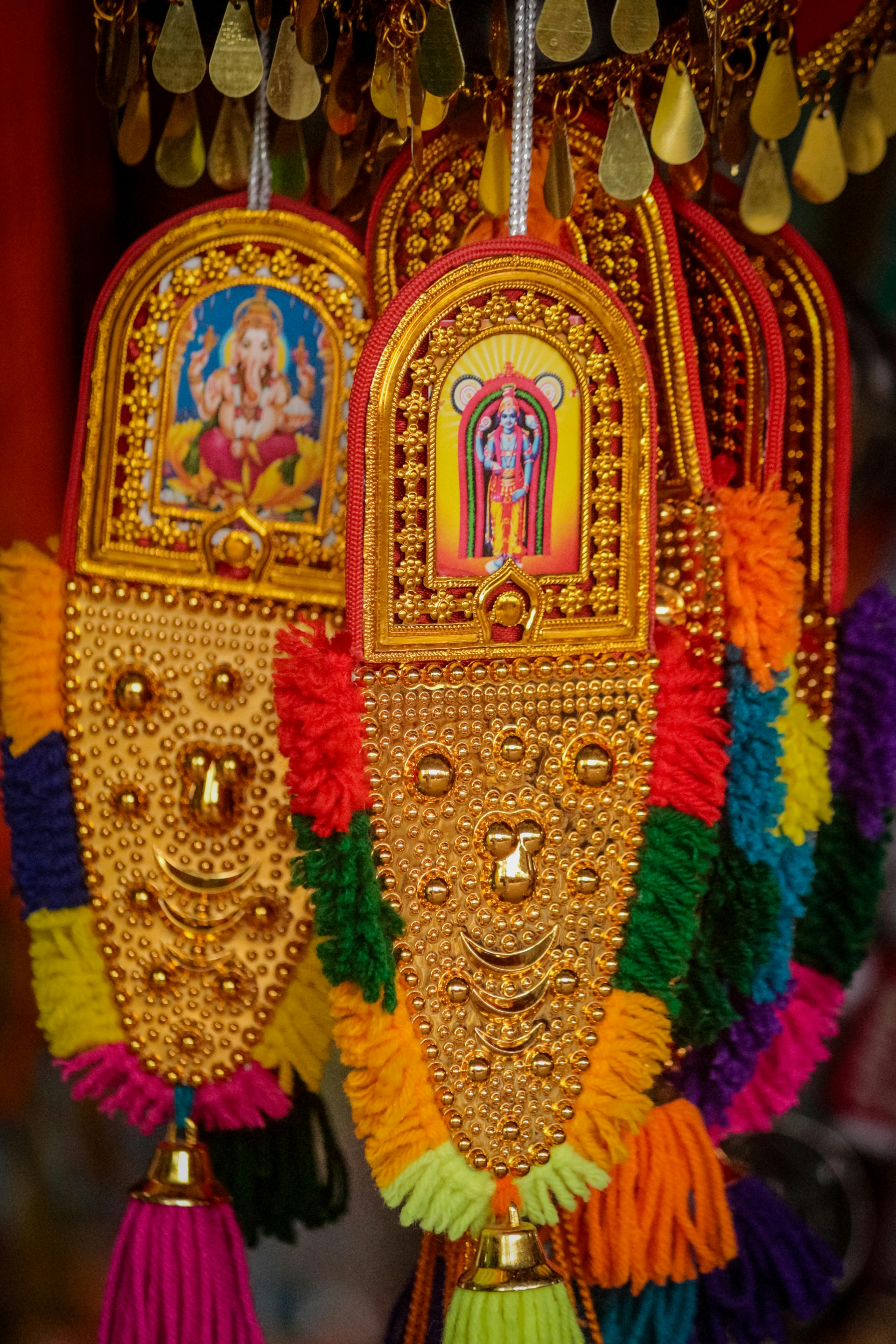 Free Vibrant festival torans featuring ornate gold designs and sacred religious symbols. Stock Photo