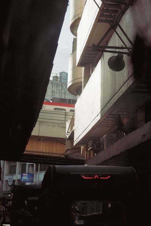 A bus is parked in a narrow alleyway