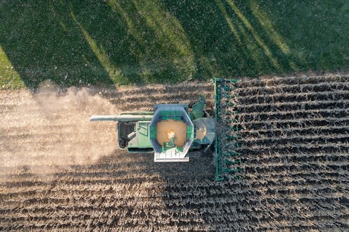 Free Aerial view of a combine harvesting a field Stock Photo