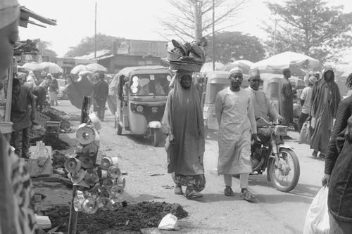 People on Street in Village in Black and White