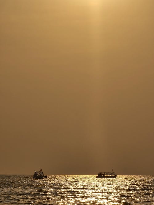 Ships on Sea at Sunset