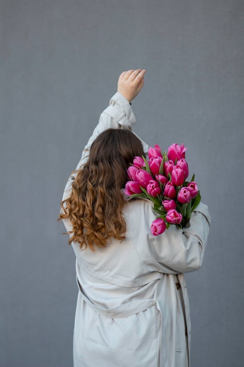 Back View of Woman with Pink Flowers