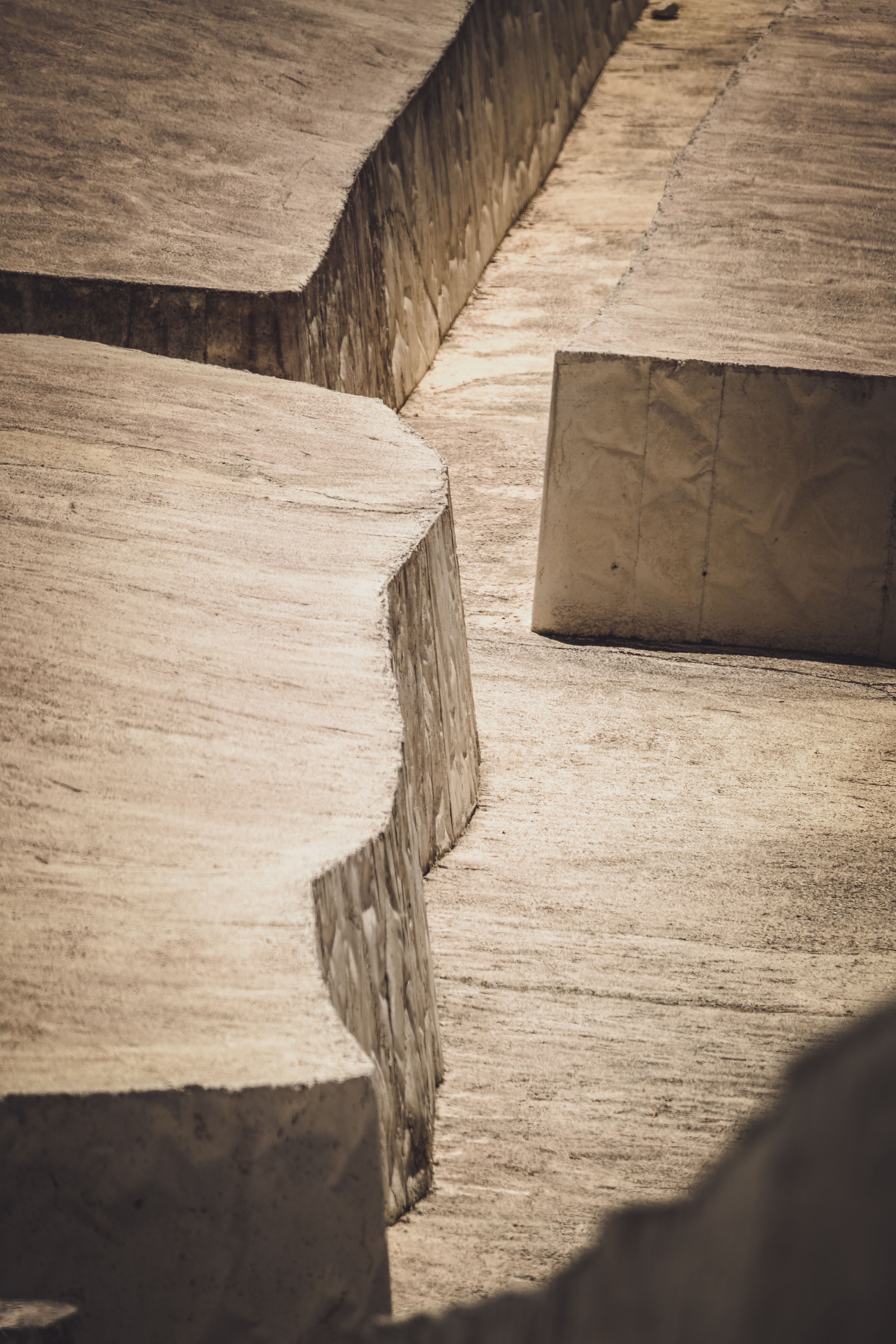 Artistic capture of the Cretto di Burri's unique, structured landscape in textured shades.