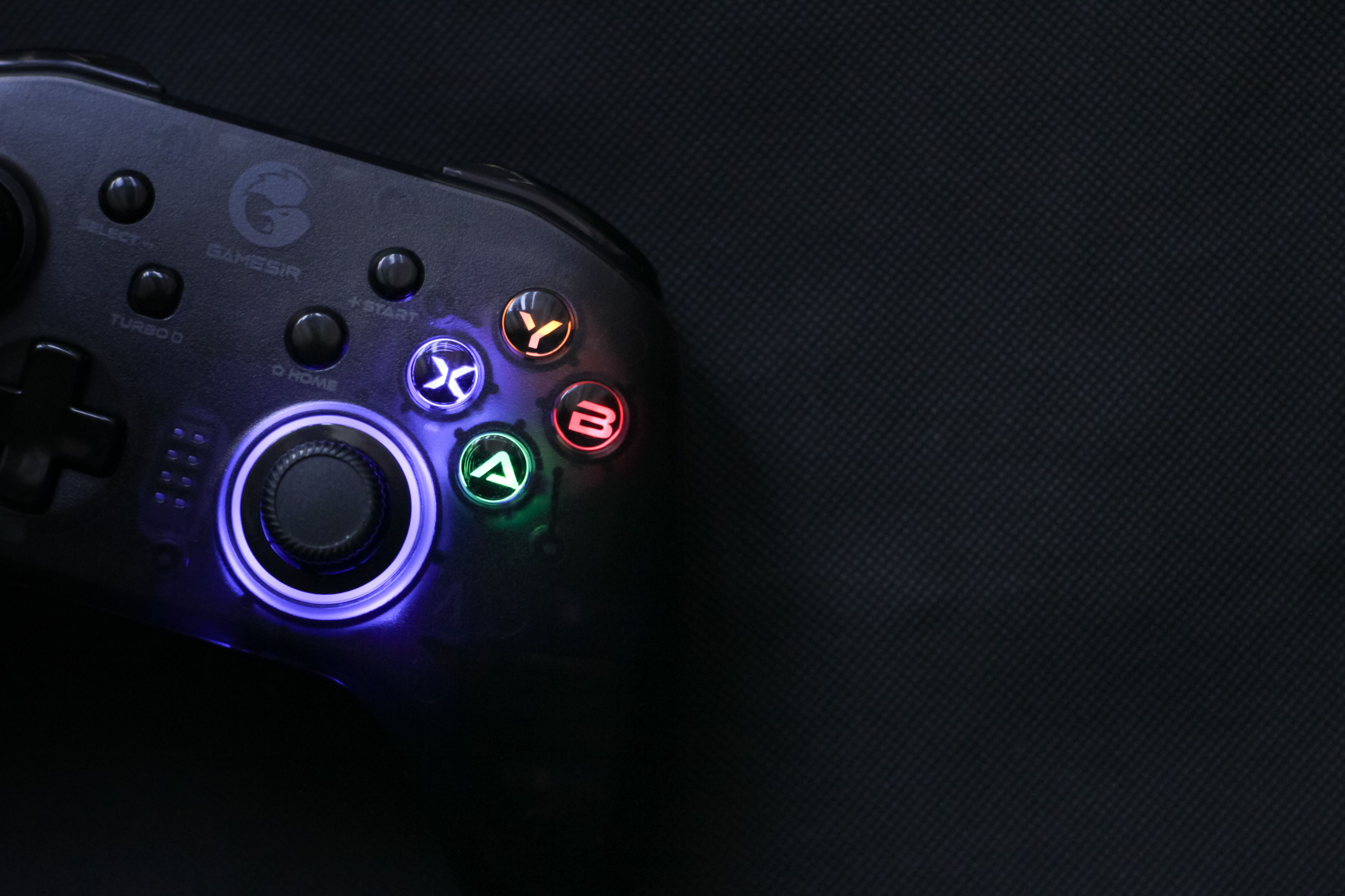A black controller with colorful lights on it · Free Stock Photo