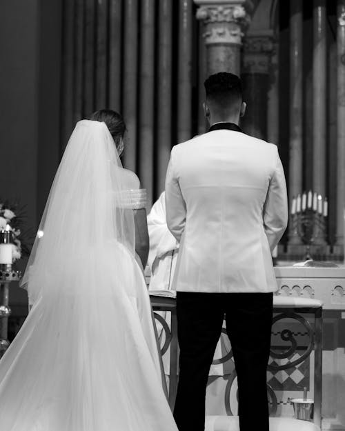 A black and white photo of a bride and groom