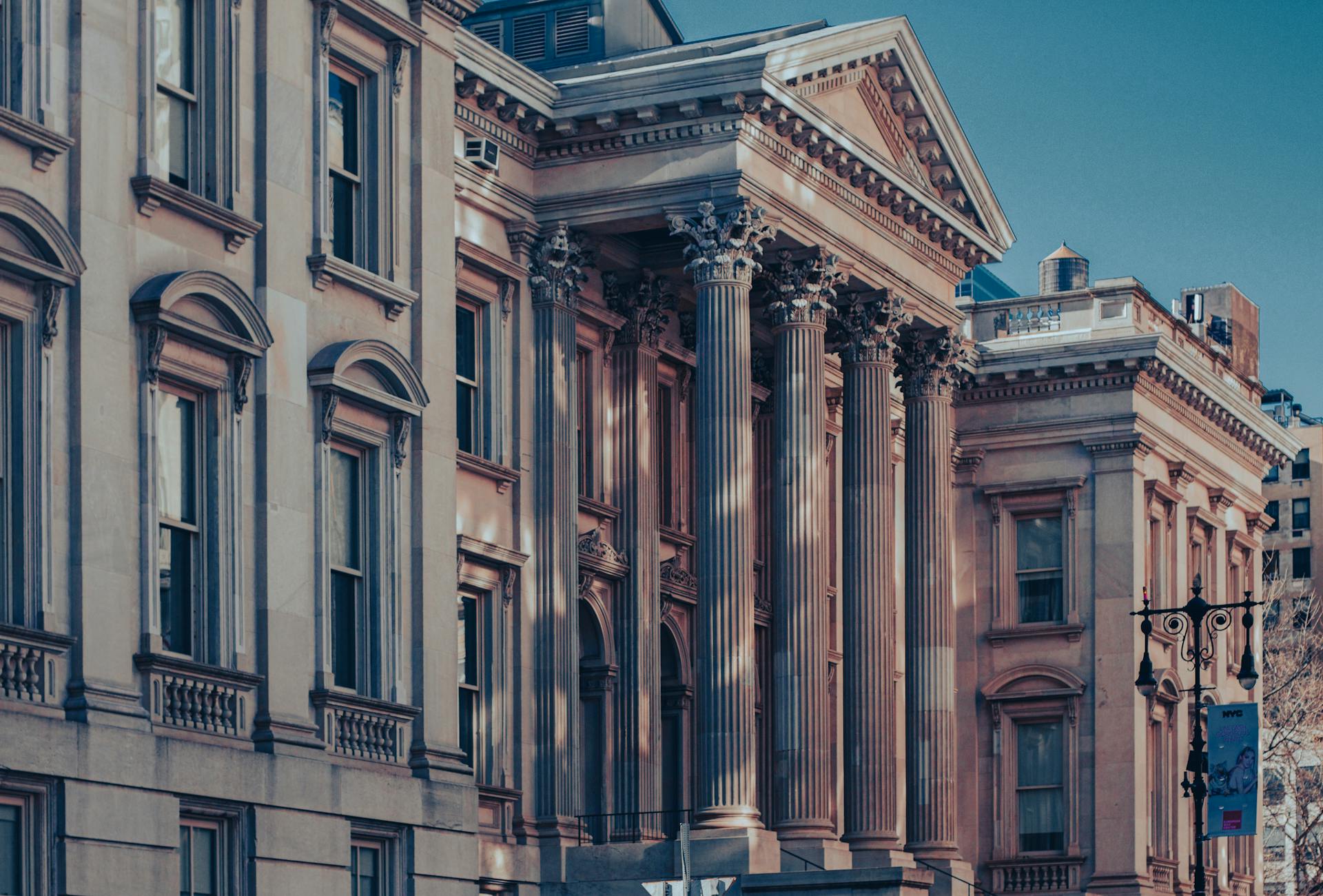 Neoclassical architecture of Tweed Courthouse in Manhattan at dusk capturing urban elegance.