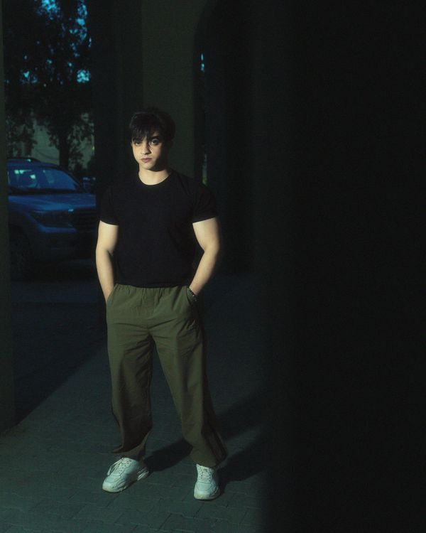 Young Man Standing with His Hands in Pockets · Free Stock Photo