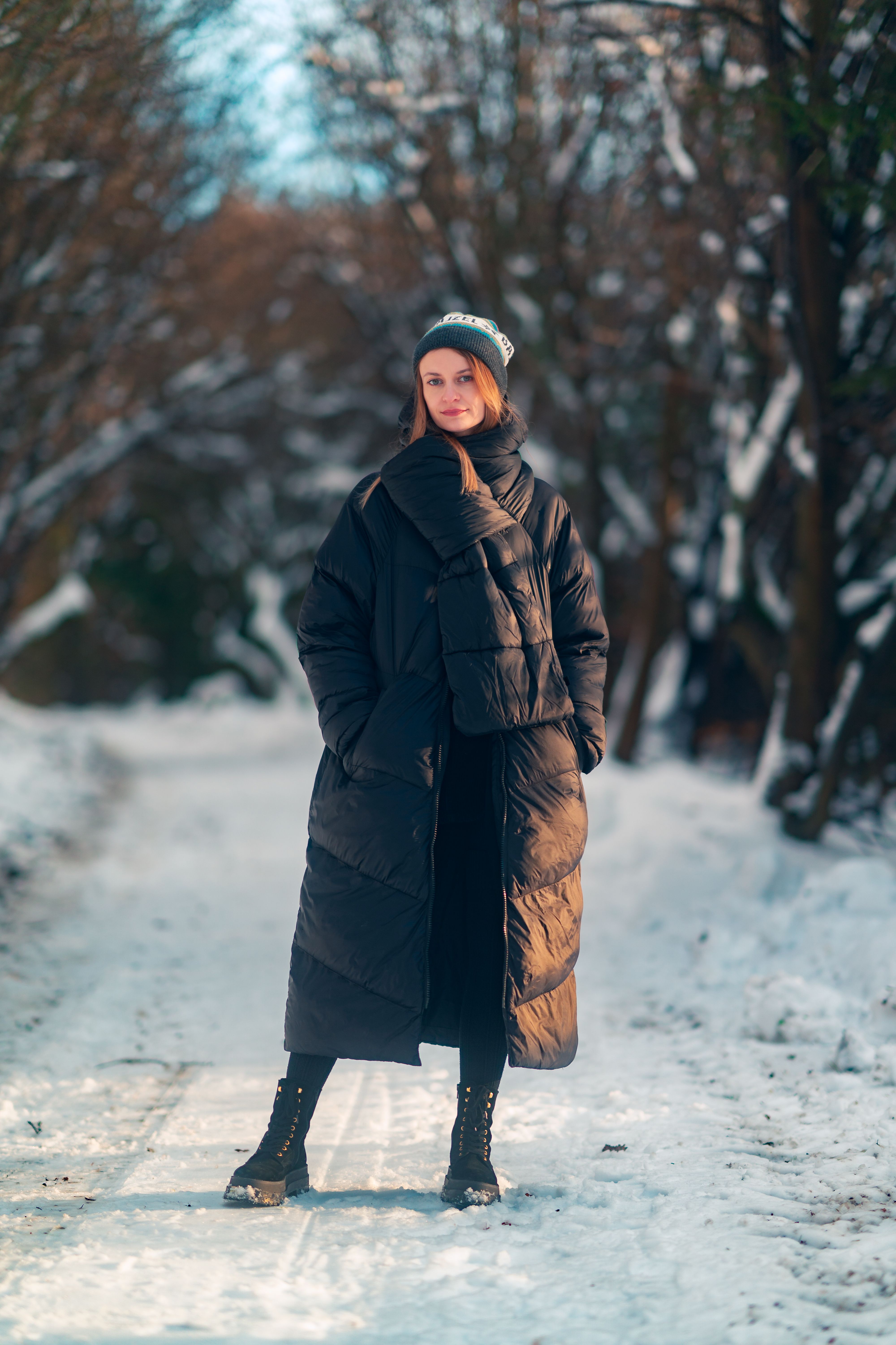 Young Woman in Winter Coat Walking Outdoors · Free Stock Photo