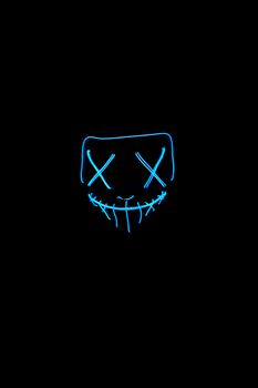 A fluorescent mask glows in the dark, creating a spooky aura.