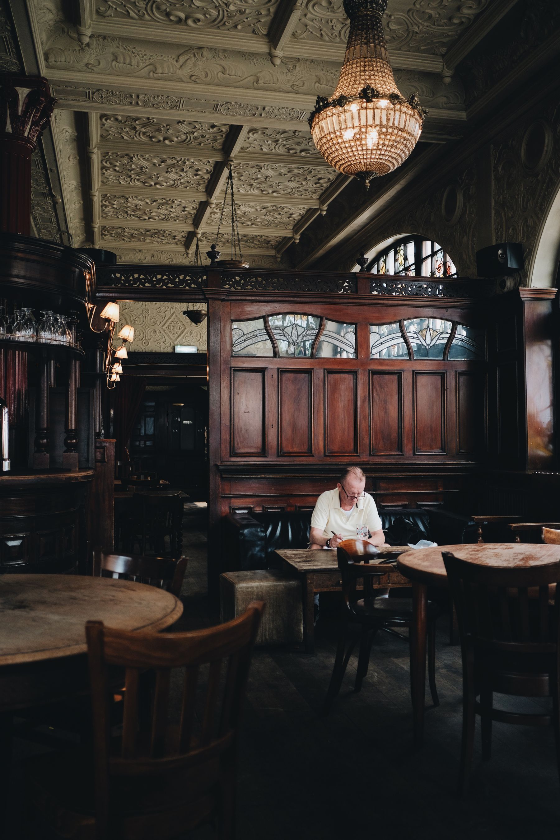 Someone eating a meal in a traditional pub