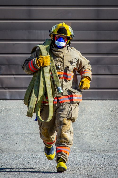 Firefigter Running Photo of a Running Firefighter · Free Stock Photo