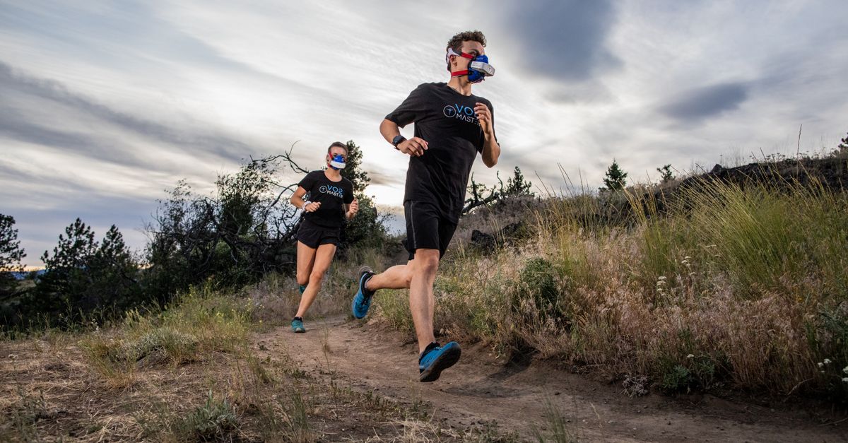 Athletes in VO2 masks running on a trail, showcasing outdoor athletic performance. - Evidence evidence guide for citrulline endurance performance meta-analysis