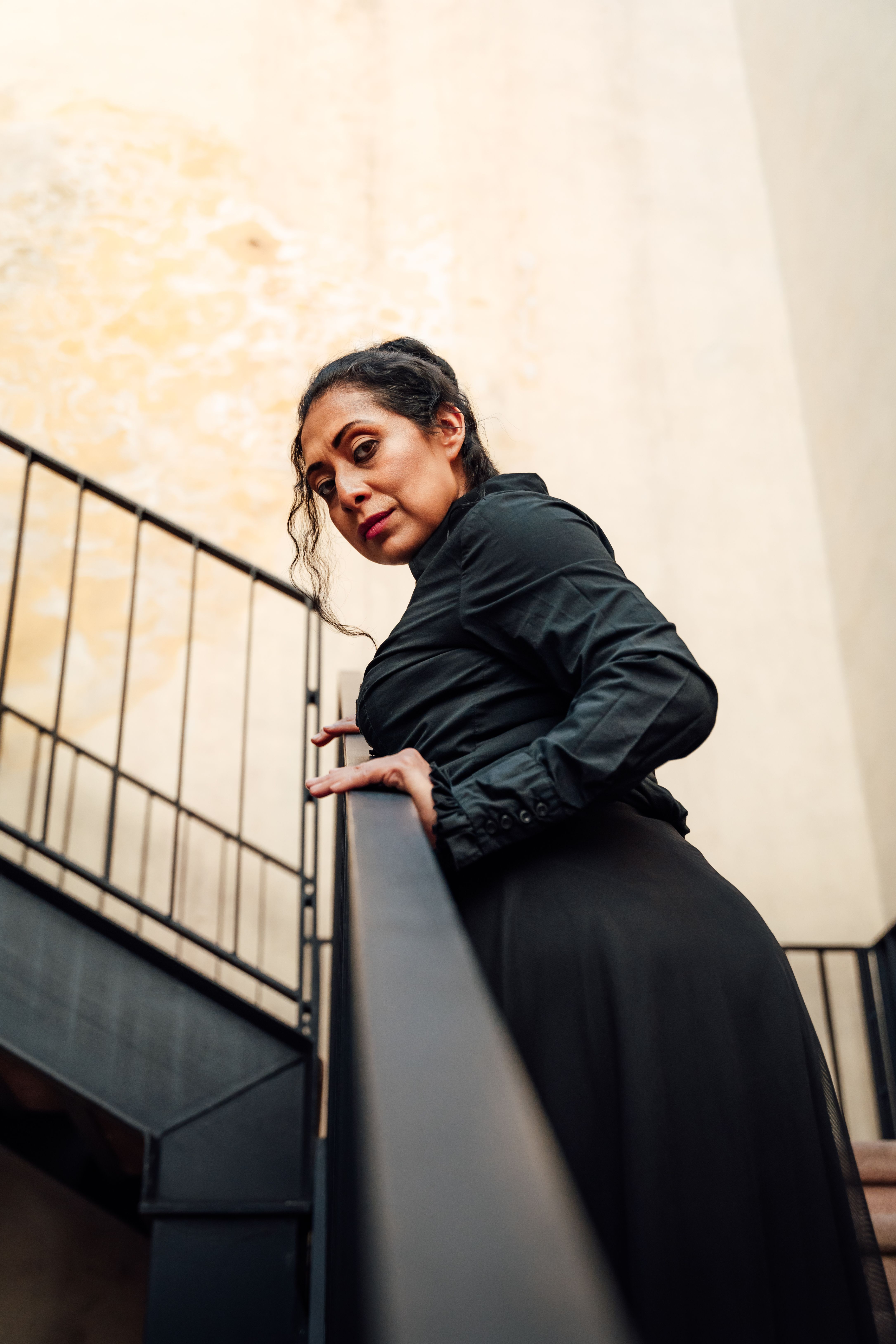 Woman in Black Dress on Stairs · Free Stock Photo