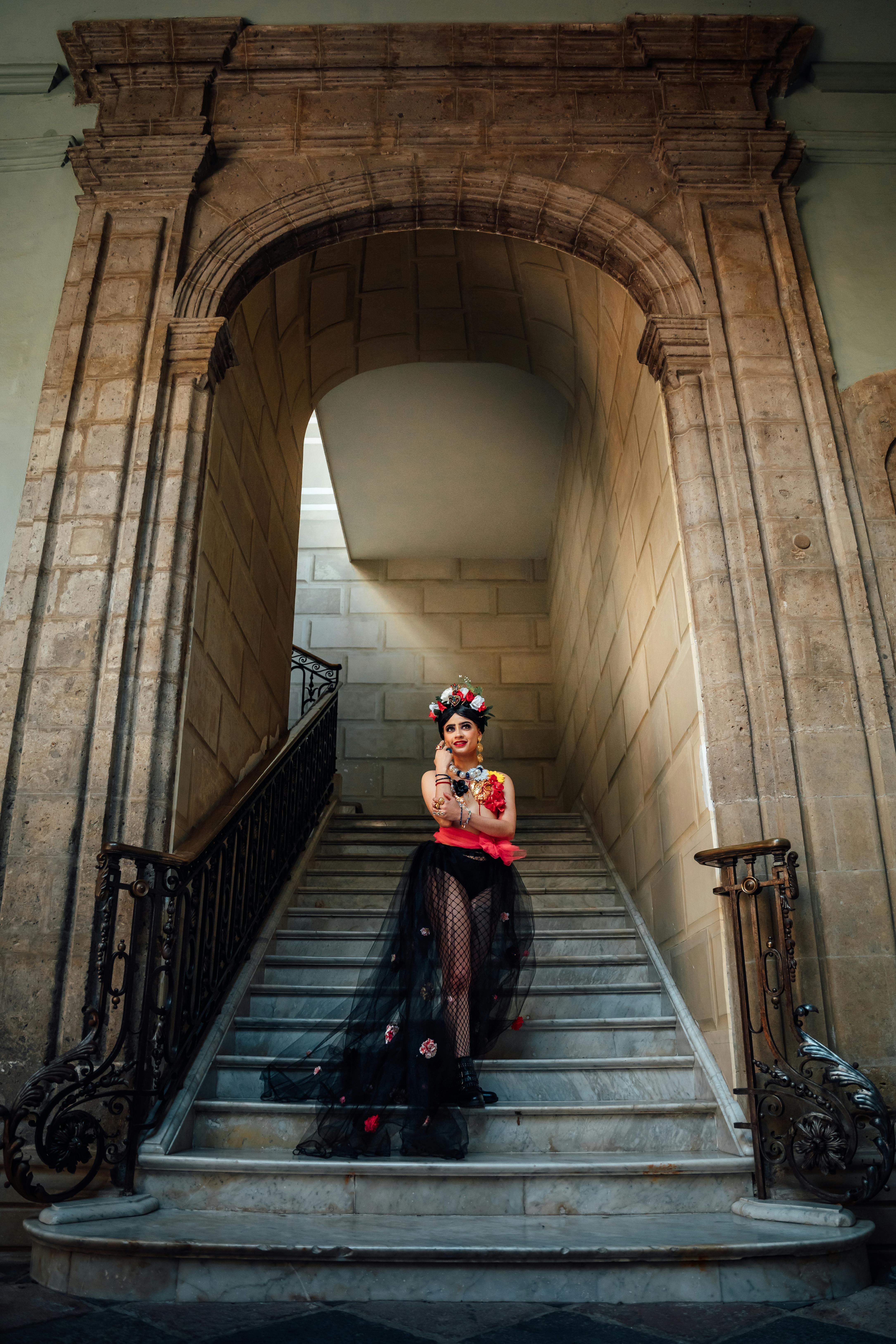 model in traditional clothing on stairs