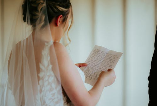 bride reading vows on her wedding day