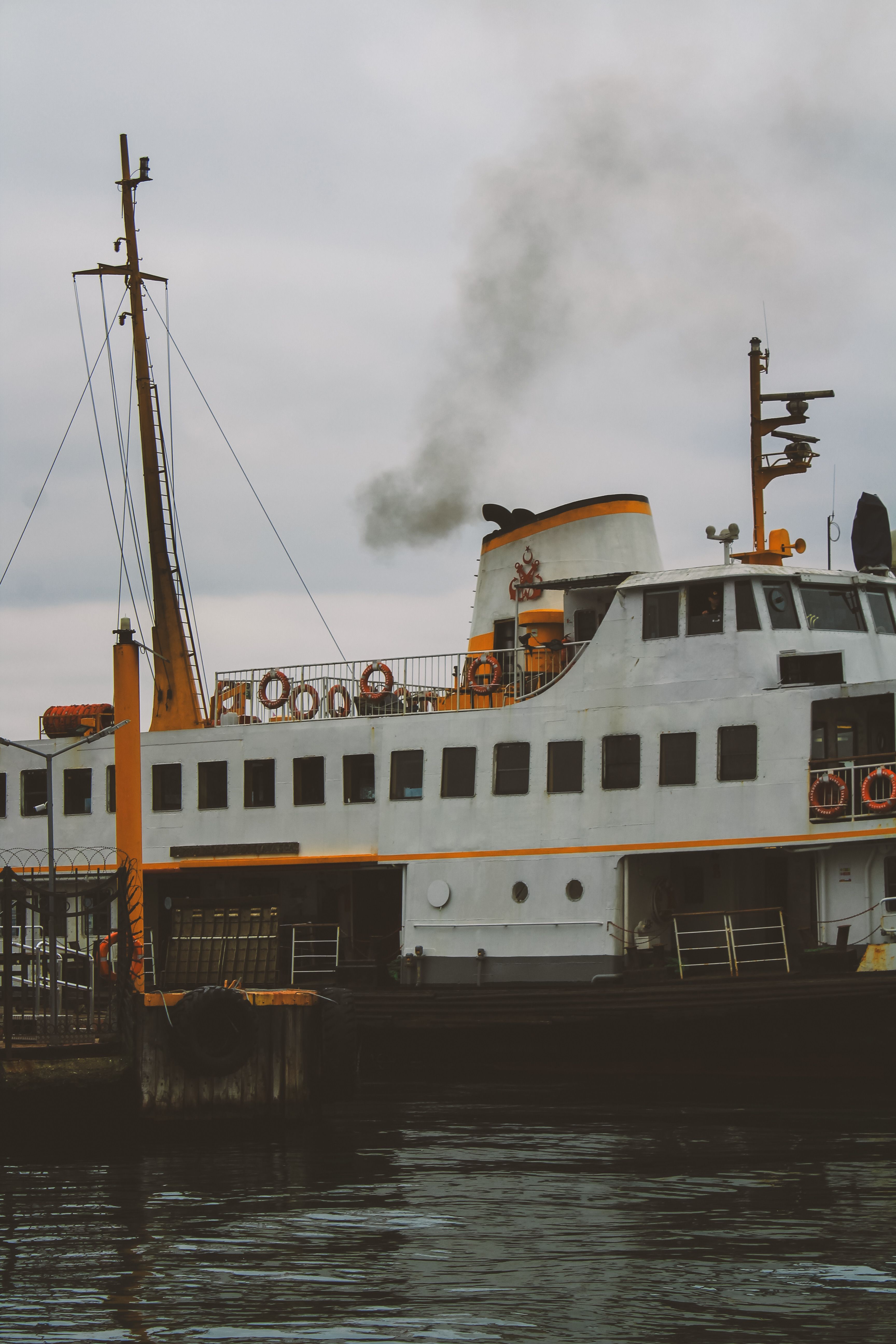 A ferry boat with smoke coming out of it · Free Stock Photo