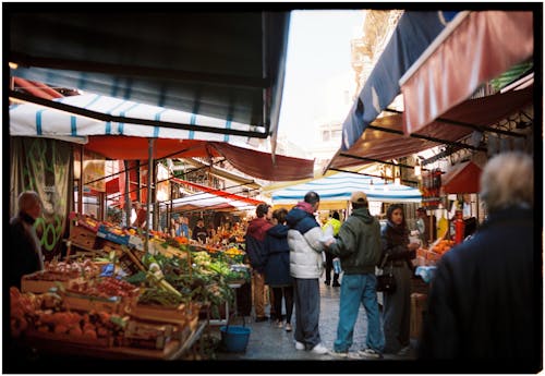 People are walking through an outdoor market