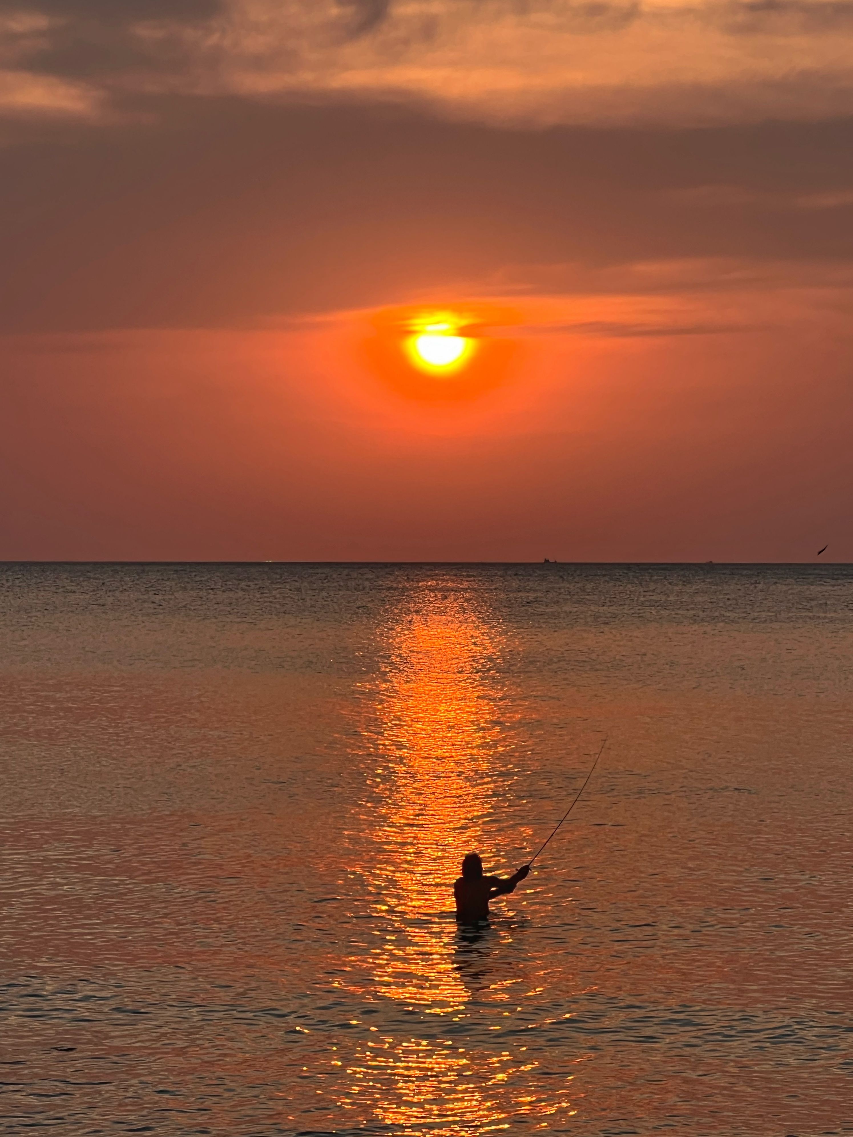 Fisherman in Sea at Sunset · Free Stock Photo