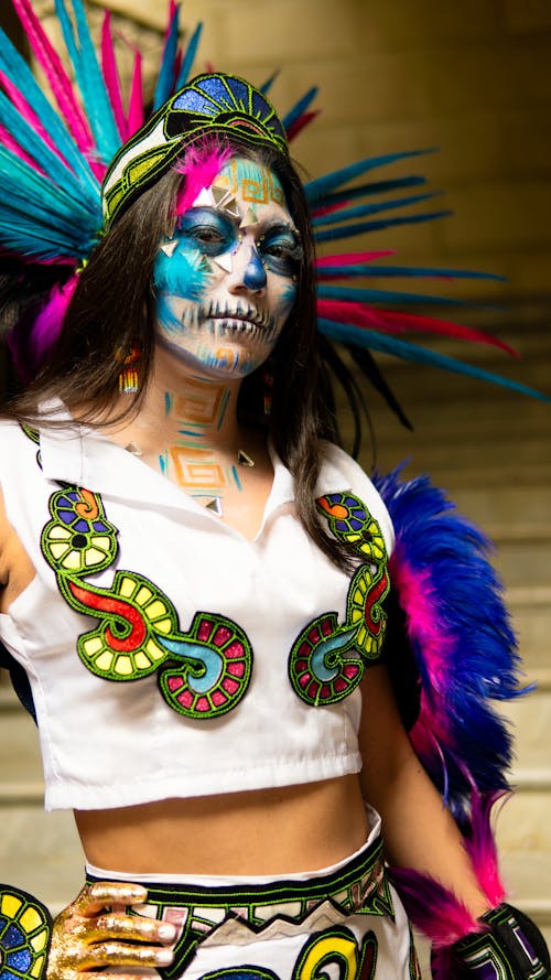 Woman with a Face Painting Wearing a Colorful Costume