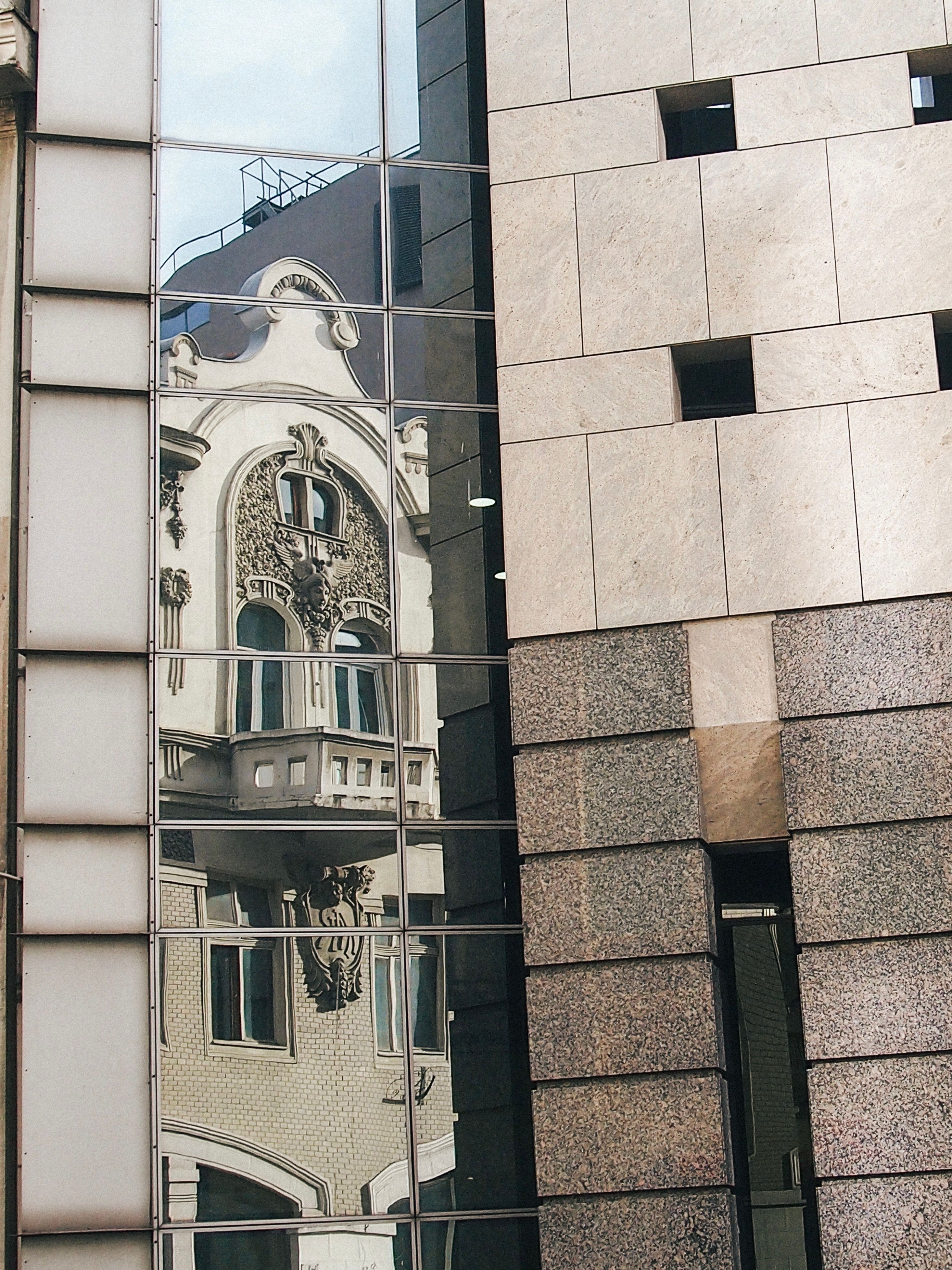 Ornamented Building Reflection in Windows · Free Stock Photo