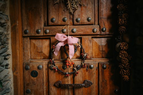 A wooden door with a wreath on it