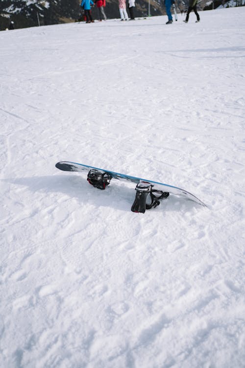 A snowboard lying on the ground