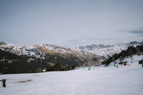 A person is skiing down a snowy slope