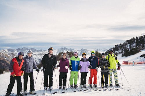 A group of people standing on a snowy slope