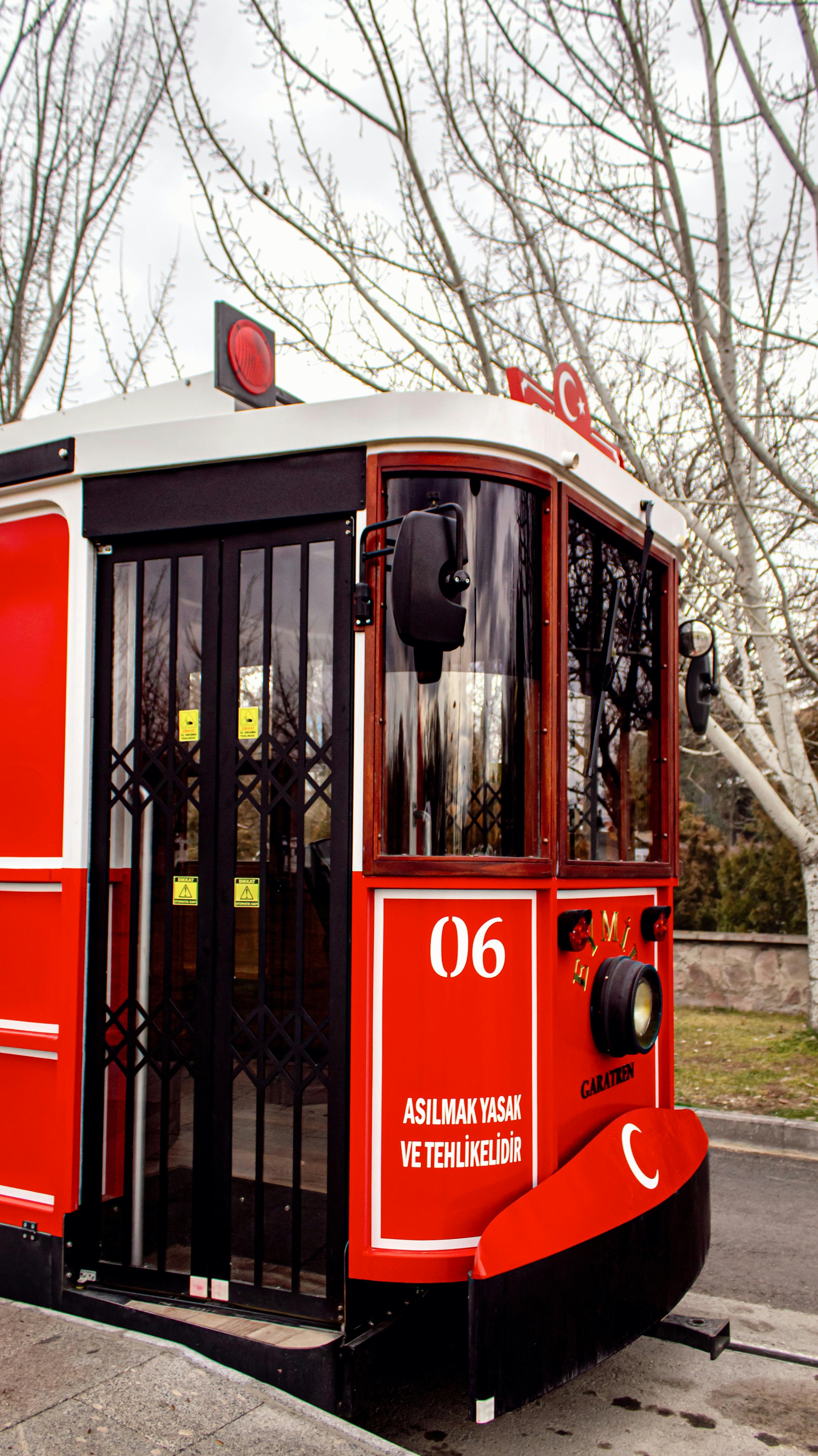 Free Old-fashioned red tram in Gölbaşı, Ankara, showcasing classic Turkish street scenery. Stock Photo