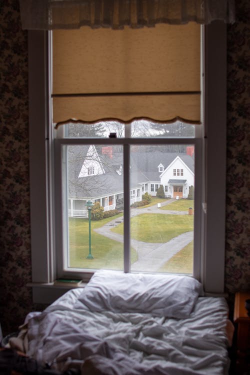 Pillow on Bed near Windows