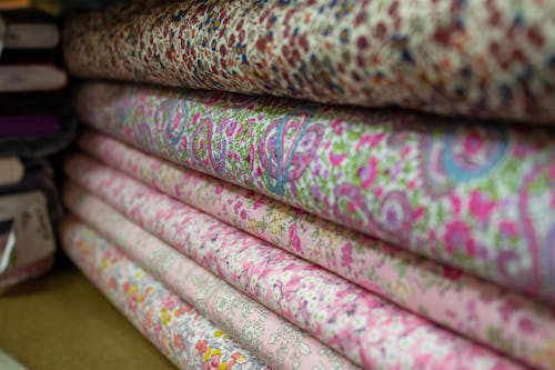 A stack of fabric with many different colors