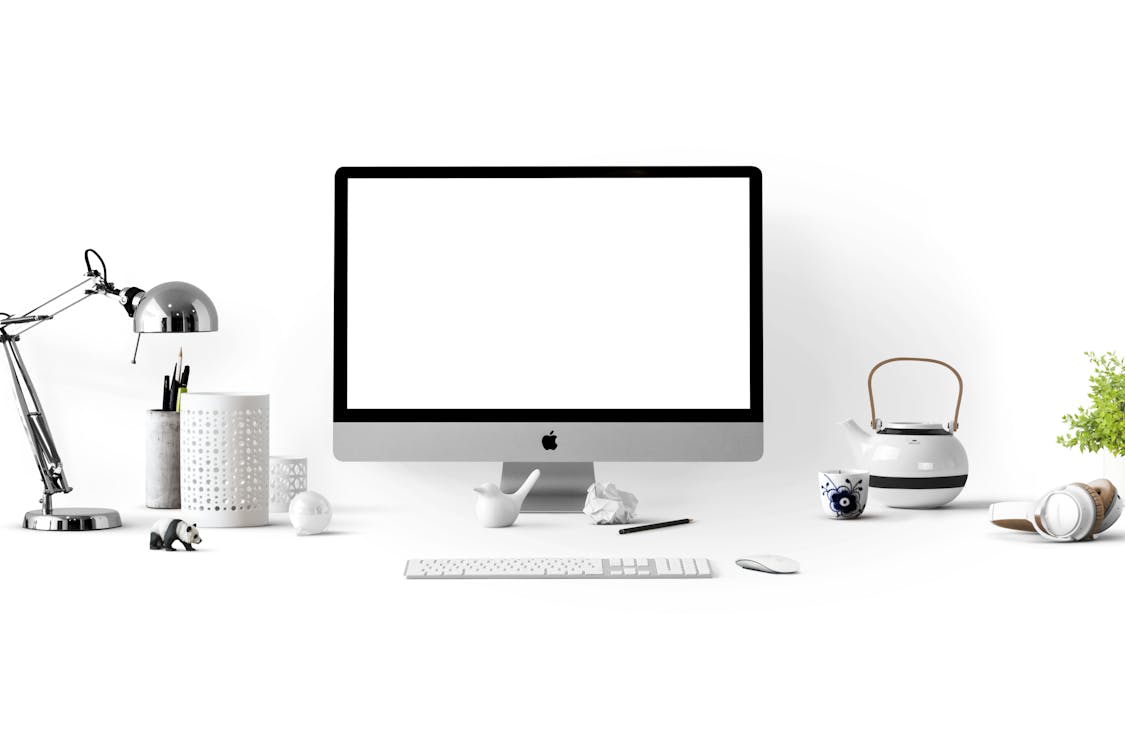 Free Silver Imac Near White Ceramic Kettle Stock Photo