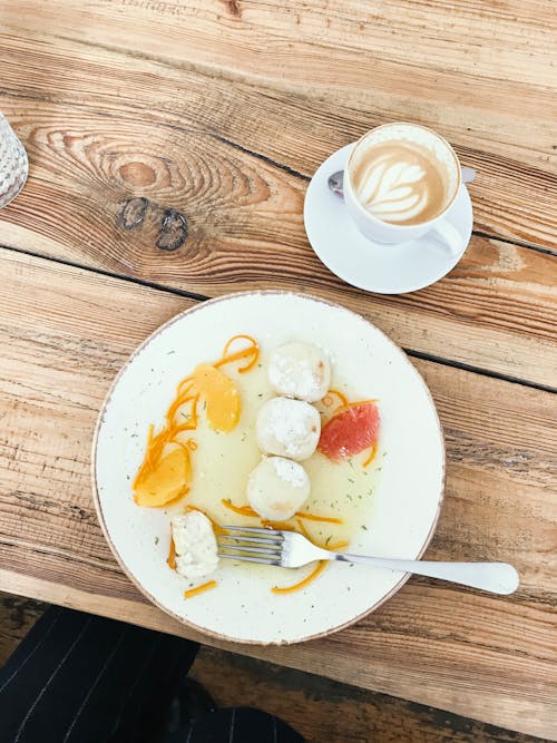 Free stock photo of blueberry cheesecake, citrus fruit, coffee