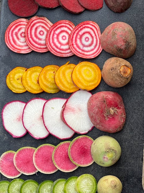 A tray of sliced radishes and beets