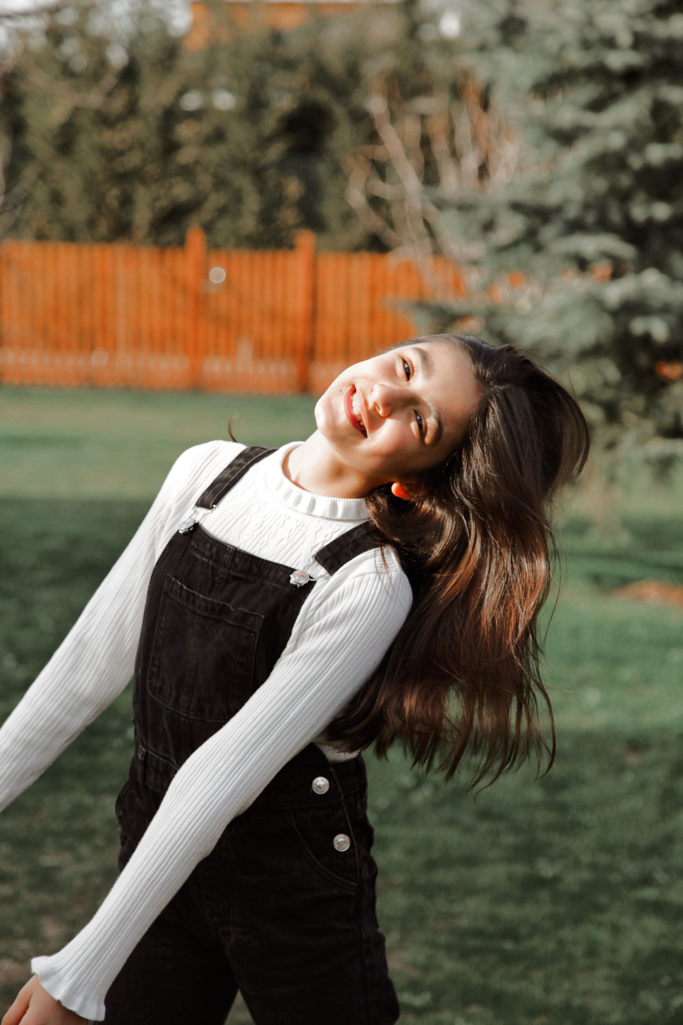 Portrait of Smiling Woman in Overalls · Free Stock Photo