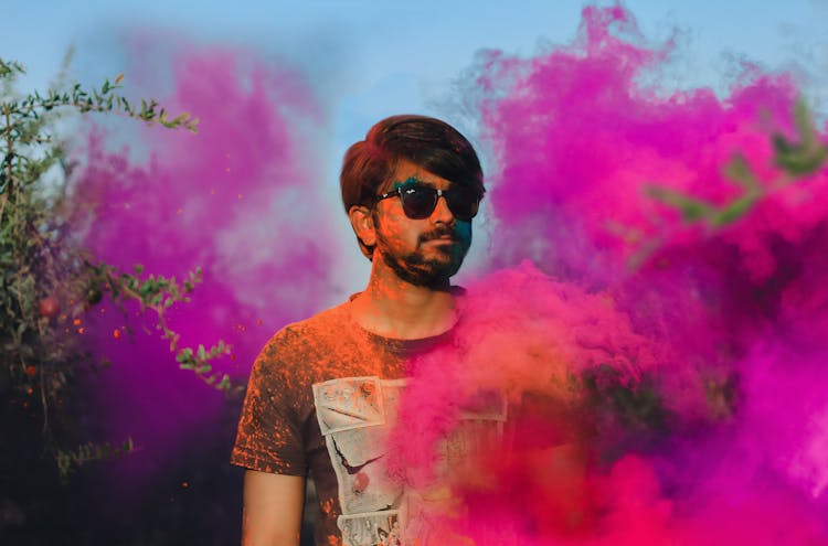 Man Standing Surrounded With Purple Smoke