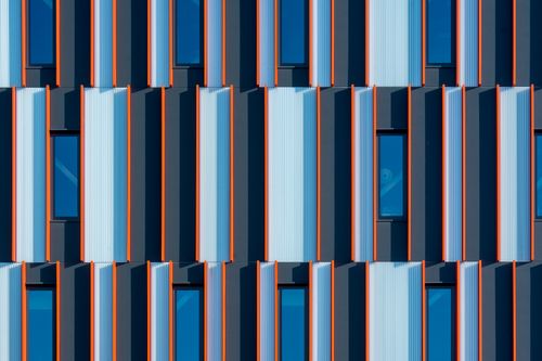 Free Close-up of a modern office building facade featuring a patterned design with windows in Rotterdam, Netherlands. Stock Photo