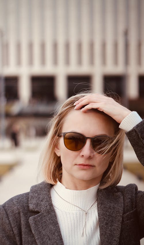 A woman with sunglasses on her head