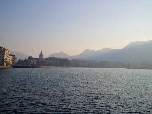 A view of the city and mountains from a boat