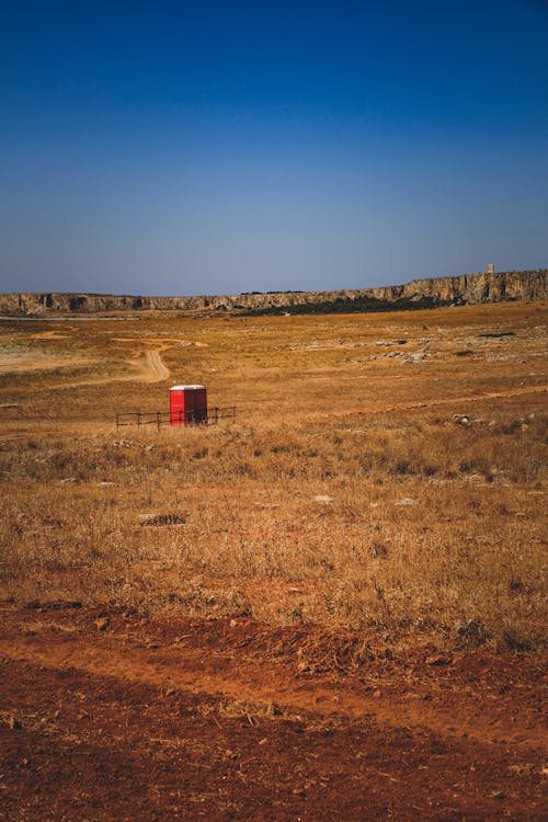 A red box in the middle of a field