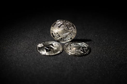 Close-up of three Ethereum coins on a dark background, showcasing digital currency themes.
