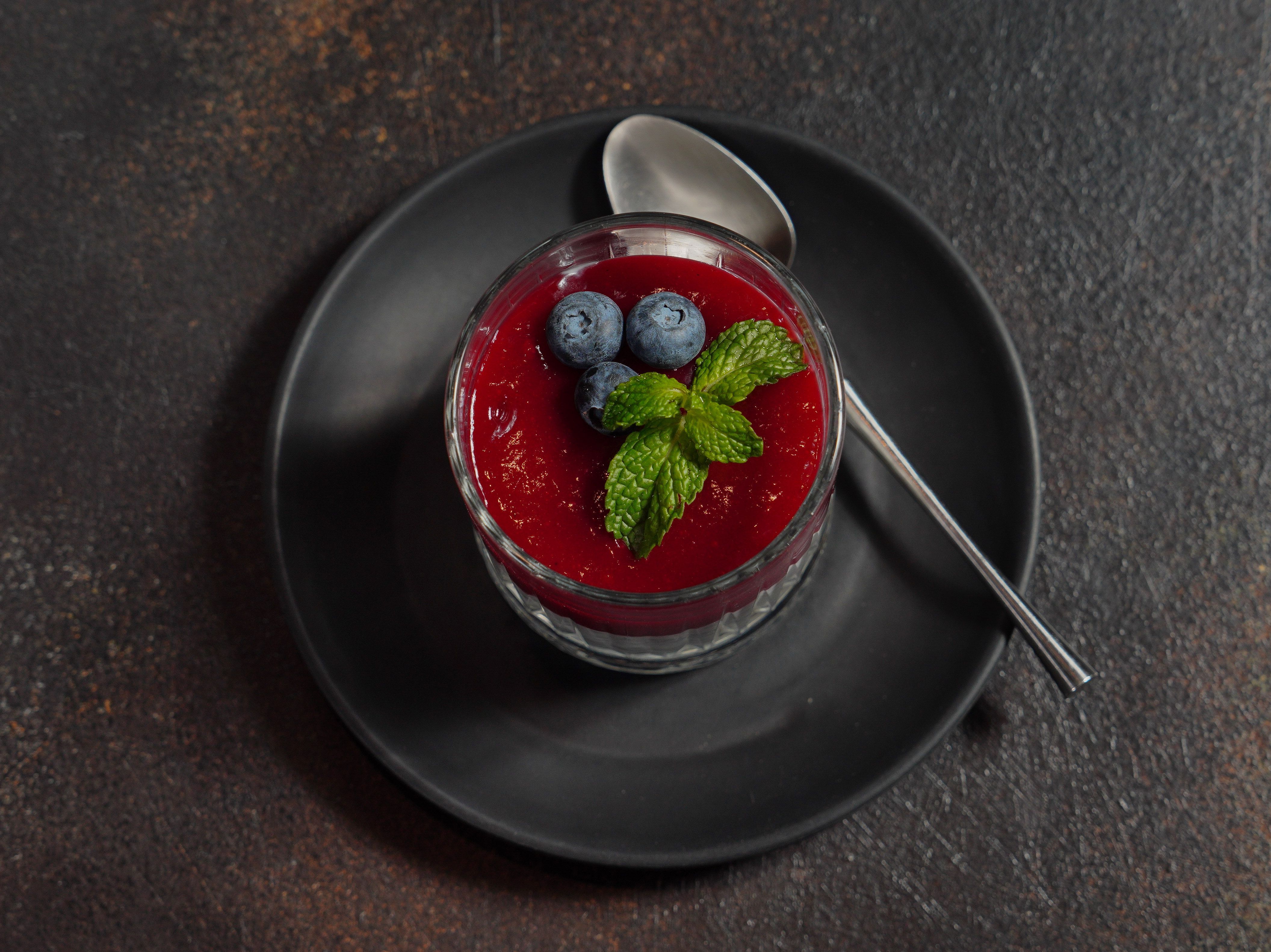 Lemon pudding brulee with blueberries in ramekins